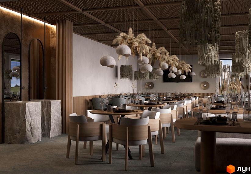 Інтер'єр ресторану в Апарт-комплексі „Меланіт Резорт & СПА“: столики, стільці, світильники та елементи декору.