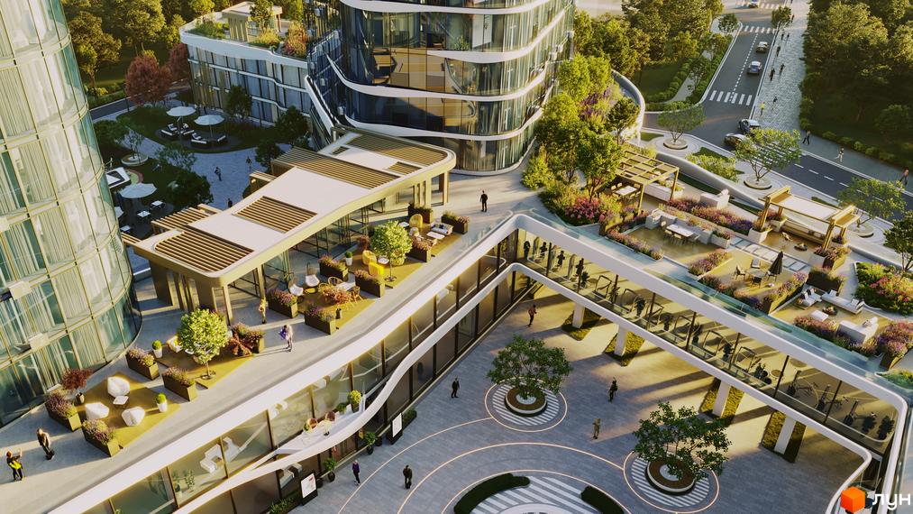 Зовнішній вигляд житлового комплексу The Light з вигнутими скляними фасадами та терасами з зонами відпочинку. Навколо комплексу зелена територія з деревами та квітами, а також дорога з автомобілями.