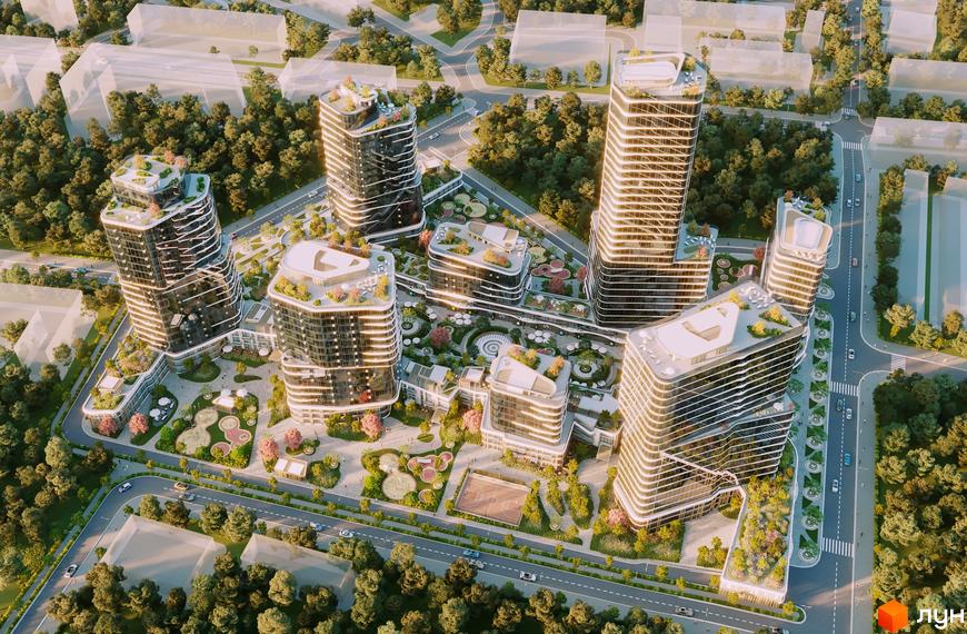 Аерофотозйомка житлового комплексу The Light з високими будівлями, що мають скляні фасади та зелені тераси. На території розташовані зони відпочинку, дитячі майданчики та спортивні зони.