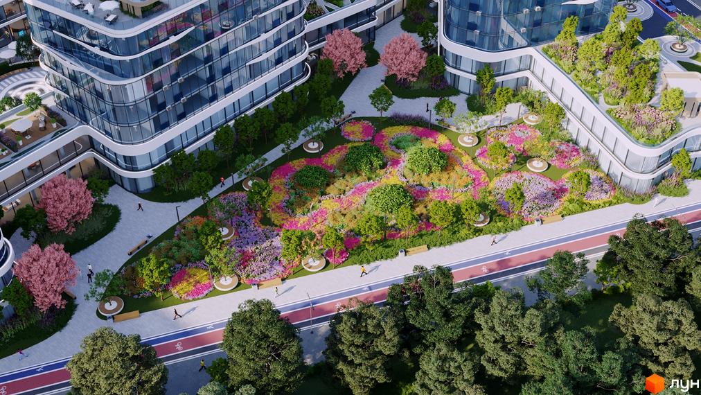 Новобудова The Light з вигнутими фасадами та багатою зеленню. На прибудинковій території розташований яскравий квітковий сад з зонами відпочинку.