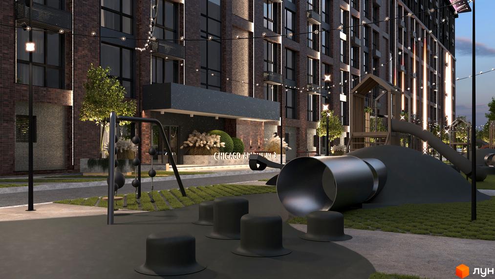 Фасад Житлового комплексу Chicago з темної цегли та великими вікнами, освітлений гірляндами. Поруч дитячий майданчик з гіркою-тунелем.