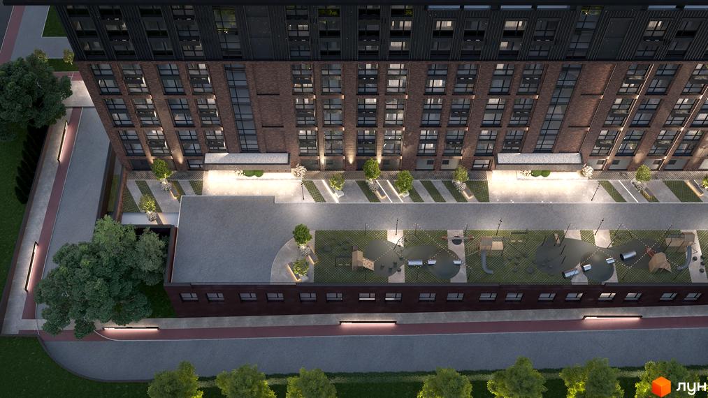 Житловий комплекс Chicago: вид зверху на цегляний будинок з великими вікнами та прибудинкову територію з дитячим майданчиком і зеленими насадженнями.