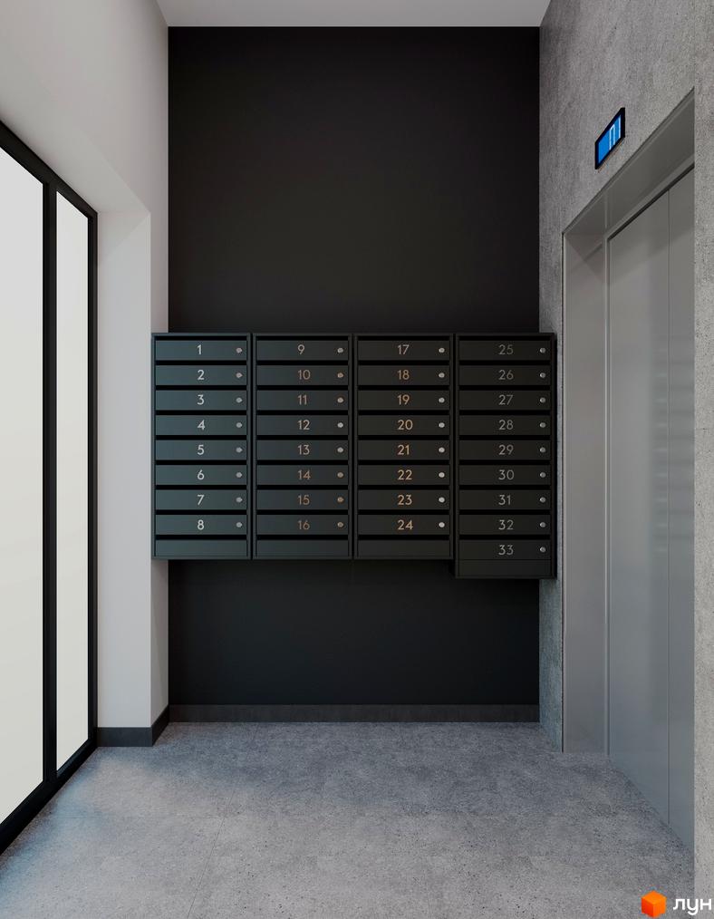 Під'їзд житлового комплексу з поштовими скриньками та ліфтом. Сірі стіни та підлога, чорні двері.