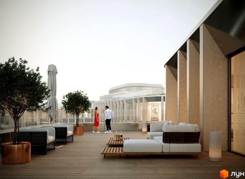 Тераса житлового комплексу Lviv City з диванами та деревами. На задньому плані видно сучасну будівлю комплексу.