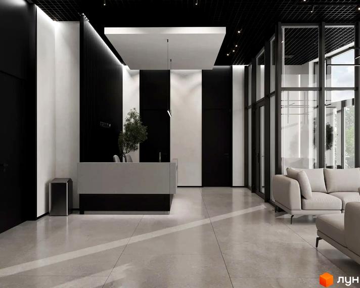 Просторе лобі Житлового комплексу FREEDOM з рецепцією та зоною відпочинку. Приміщення має великі вікна та контрастний дизайн.