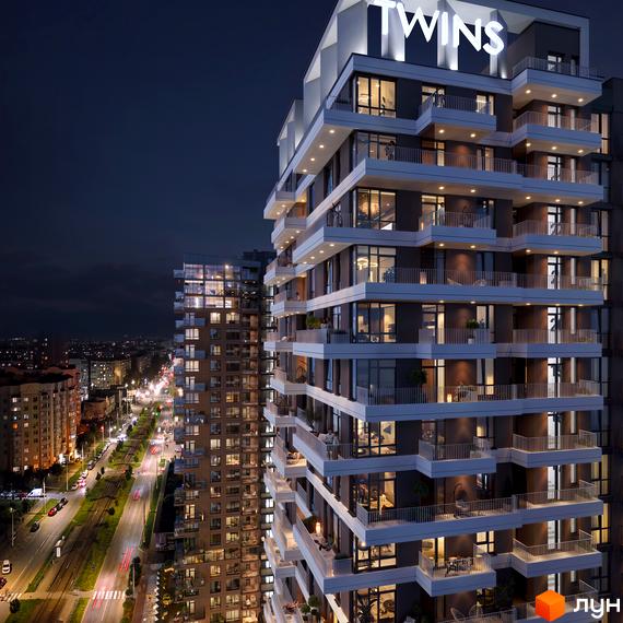 Житловий комплекс TWINS у вечірньому міському пейзажі. Багатоповерховий будинок з балконами та підсвіченими вікнами.