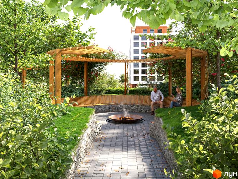 Зона відпочинку з перголою та лавками біля житлового комплексу Олімпійський White. Навколо багато зелені та дерев, що створює затишну атмосферу.