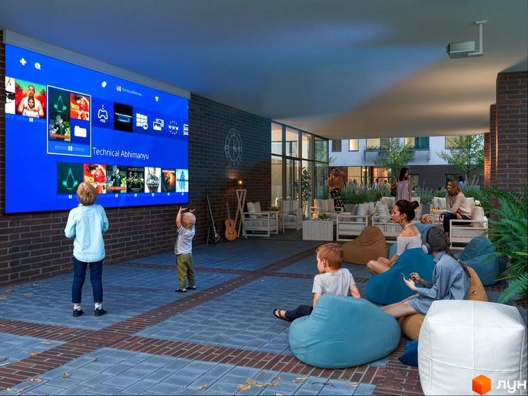 Зображення сторінки ЖК Olympic White: діти дивляться фільм на великому екрані у дворі, поруч з місцями для відпочинку та озелененням.