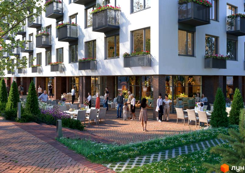 Зовнішній вигляд житлового комплексу Олімпійський White з балконами та квітами на фасаді. На прибудинковій території розташовані столики з відвідувачами та зелені насадження.