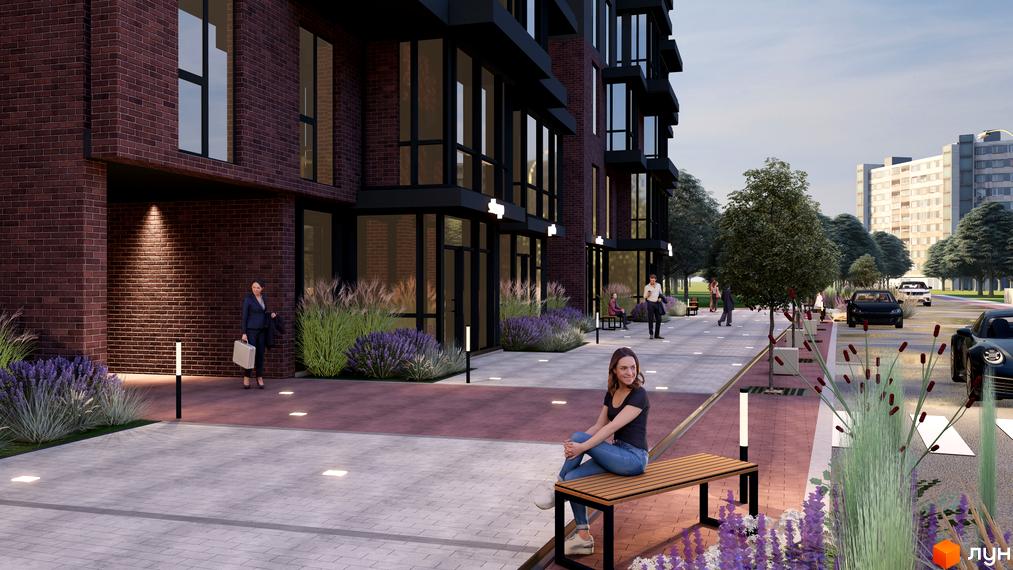 Зовнішній вигляд будівлі житлового комплексу Науковий з цегляними фасадами та благоустроєною прибудинковою територією з ландшафтним дизайном.