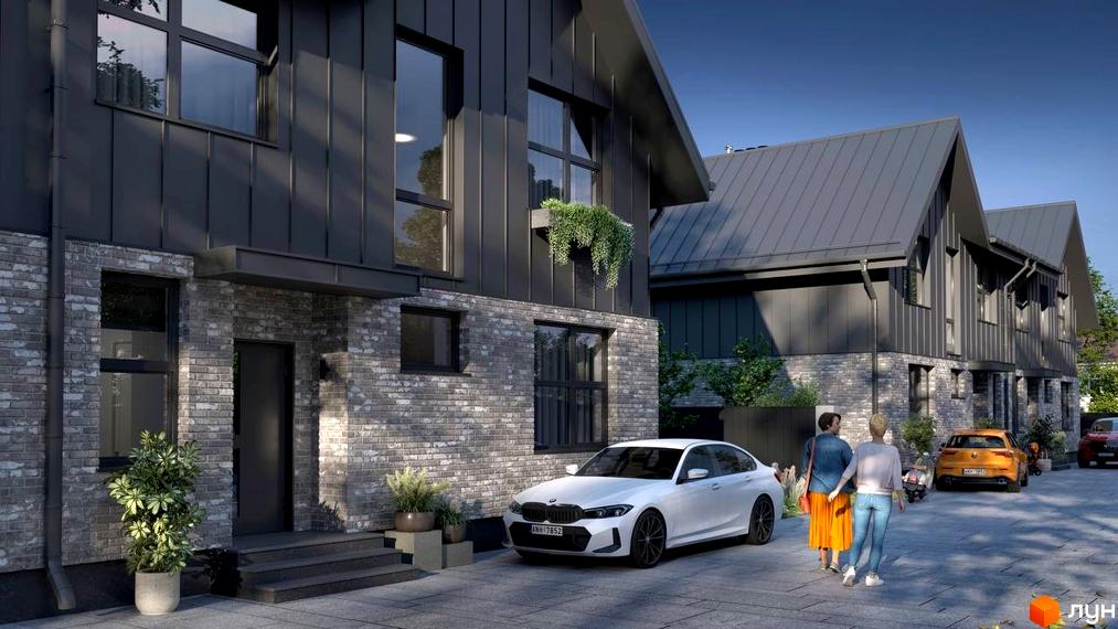 Дуплекси на Булгакова – це житловий комплекс з цегляними фасадами та темними дахами, розташований на брукованій прибудинковій території з автомобілями та пішоходами.