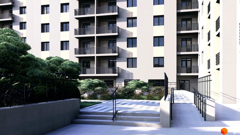 Фасад житлового комплексу Браво світлого кольору з темними вікнами та балконами. Перед будинком зелені насадження, доріжки та пандус з поручнями.