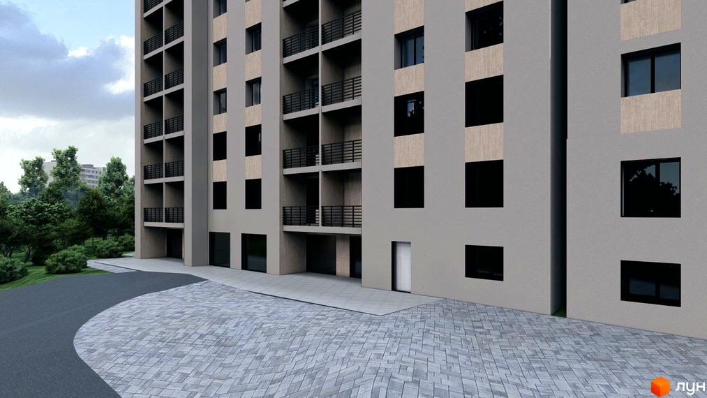Фасад Житлового комплексу Браво з сірими стінами та балконами. Перед будинком бруківка, дорога та зелені насадження.