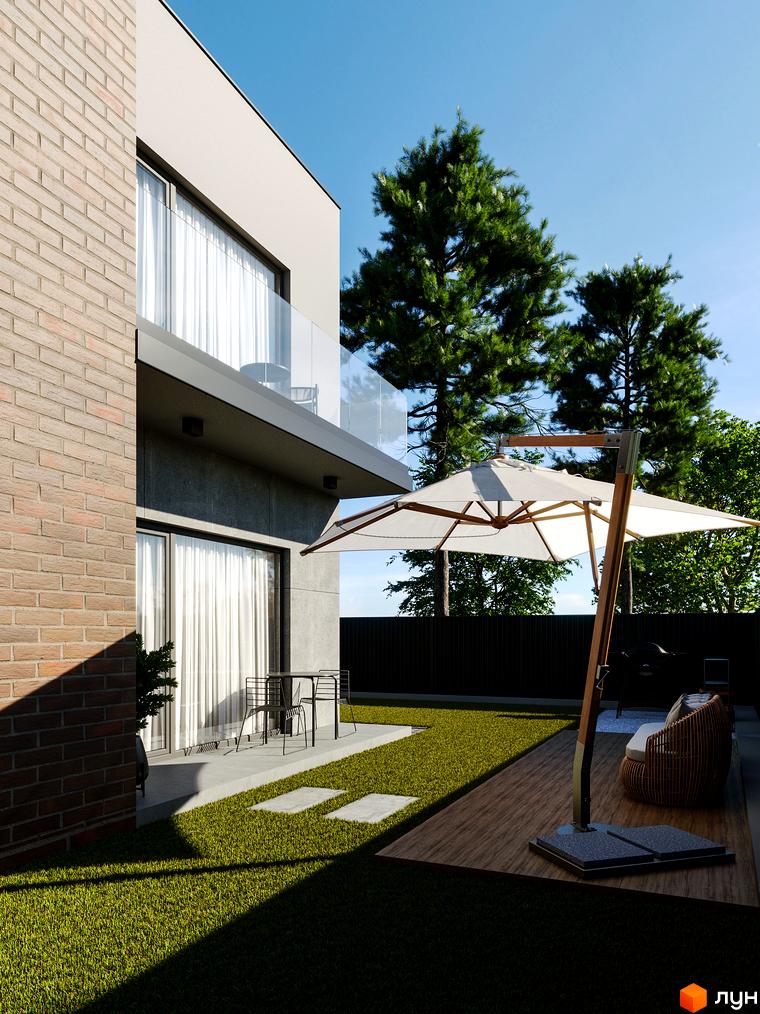 Таунхауси Chelsea Town з цегляним фасадом та великими вікнами, з терасою, парасолькою та зеленою галявиною.