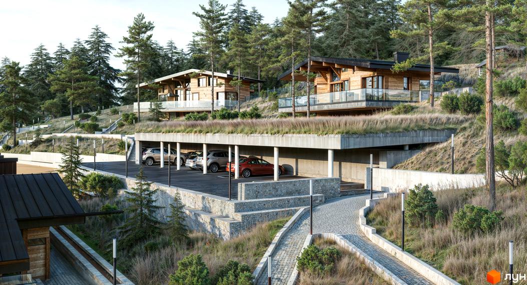 Котеджне містечко Veres Hill з дерев'яними фасадами та скляними балконами розташоване на схилі серед соснового лісу, з підземним паркінгом та брукованою дорогою.