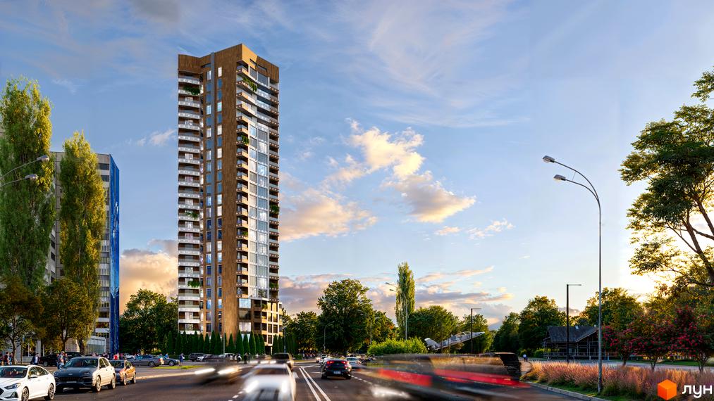Житловий комплекс Grand Tower – висотна новобудова з панорамними вікнами та балконами, розташована вздовж дороги з деревами та вуличним освітленням.