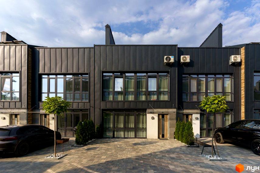 Таунхаус Black edition з темним фасадом та великими вікнами. Прибудинкова територія вимощена бруківкою, є зелені насадження та парковка.