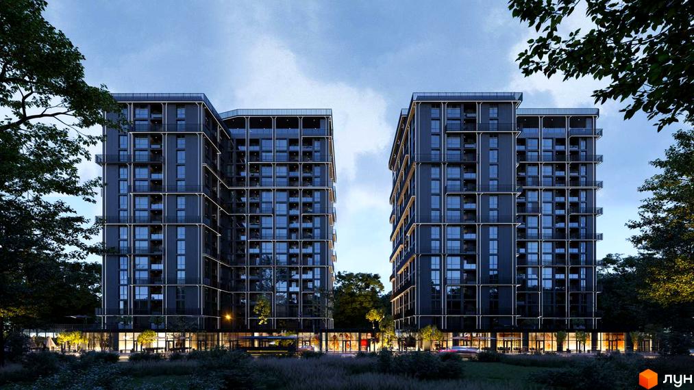 Два багатоповерхові будинки житлового комплексу PARK AVENUE premium з темним фасадом та підсвіченими контурами. Навколо будинків багато зелені та освітлена прибудинкова територія.