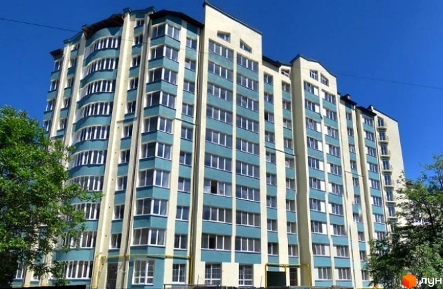 Зображення фасаду багатоповерхового житлового будинку на вулиці Гарбарська. Вигляд новобудови з великою кількістю вікон та балконів.