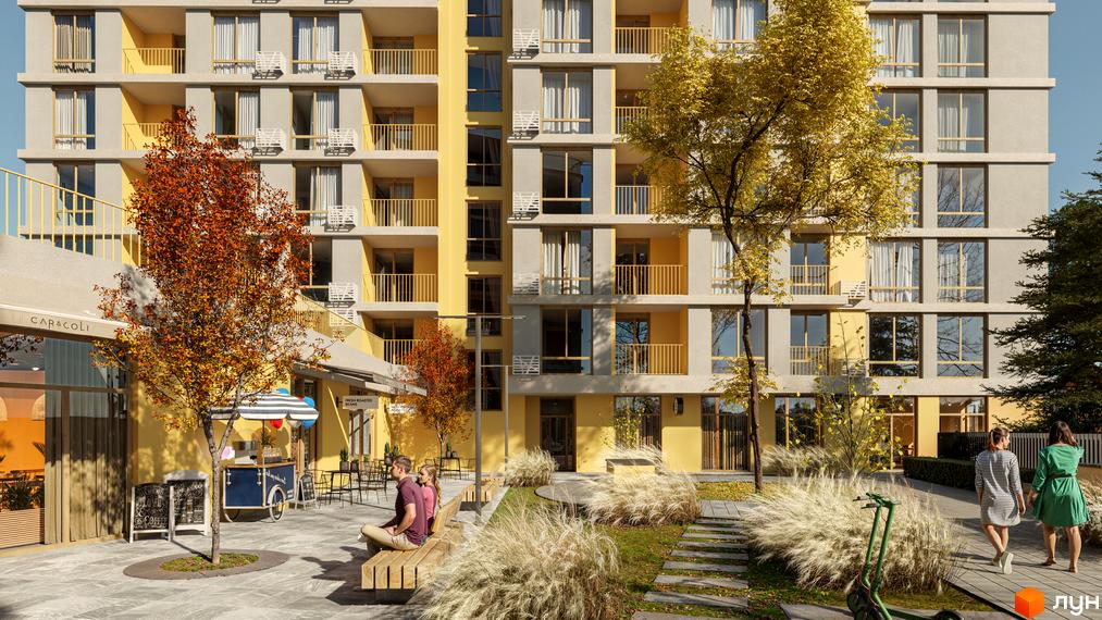 Багатоповерховий будинок Житлового комплексу Кленовий двір з сірими та жовтими фасадами, балконами. Прибудинкова територія з деревами, лавками та зоною відпочинку.