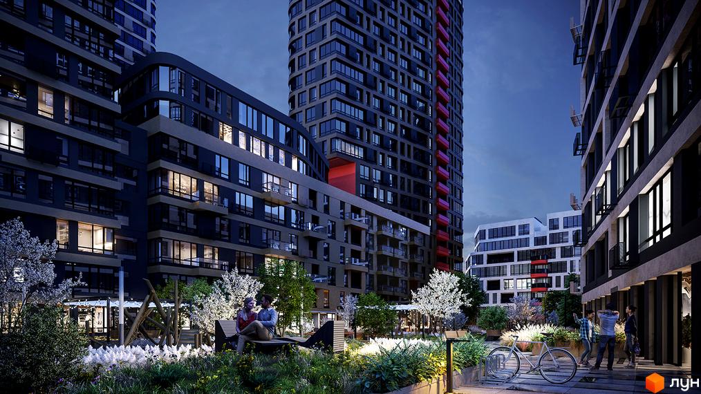 Сучасний житловий комплекс з високими будинками та доглянутою прибудинковою територією з зонами відпочинку та зеленню.