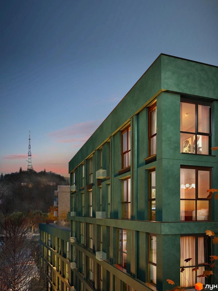 Зовнішній вигляд новобудови ORLAN RESIDENTS з зеленим фасадом та великими вікнами на тлі вечірнього неба та телевежі.