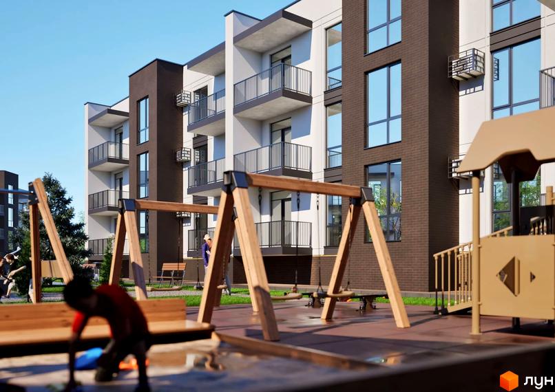 Житловий комплекс Баварія: фасади будівель з коричневої та білої цегли, балкони з чорними перилами, дитячий майданчик з гойдалками та пісочницею.