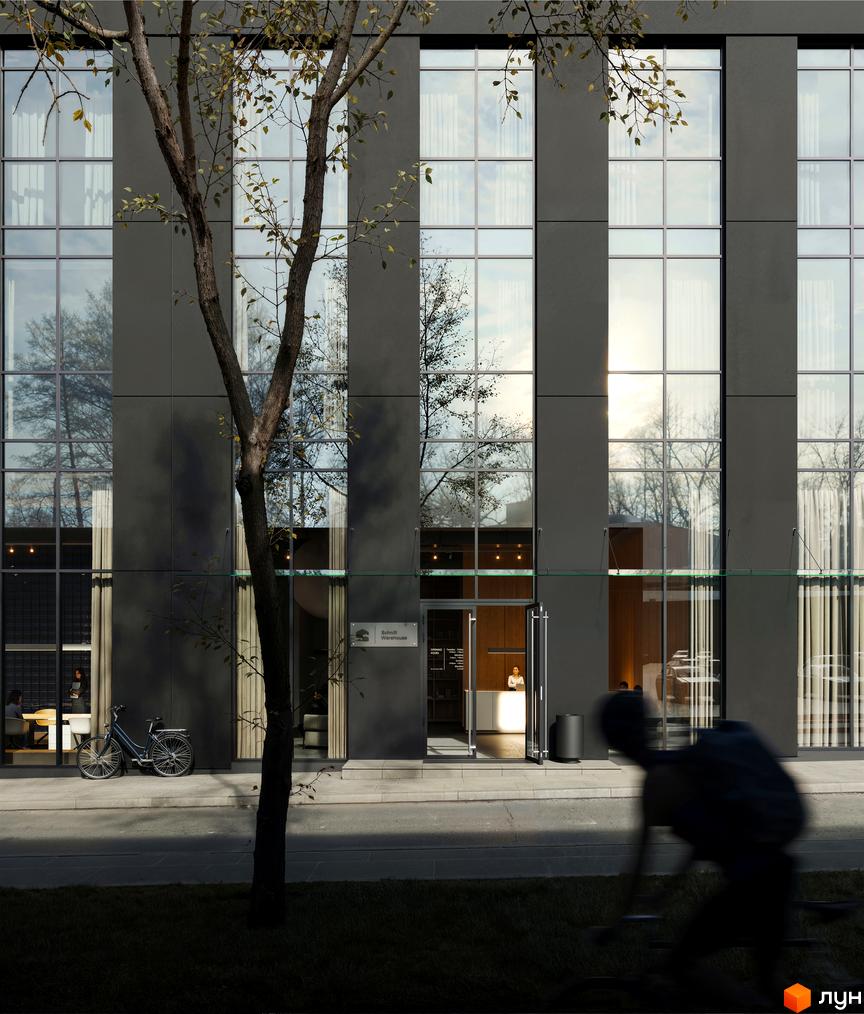 Фасад житлового комплексу Avalon Up з великими вікнами та деревами. Поруч велосипед та вхід до будівлі з рецепцією.
