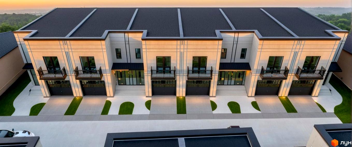 Зображення сторінки житлового комплексу Elite Home II. Будинки з темною покрівлею, балконами та гаражами. Перед будинками - доріжки та зелені газони.