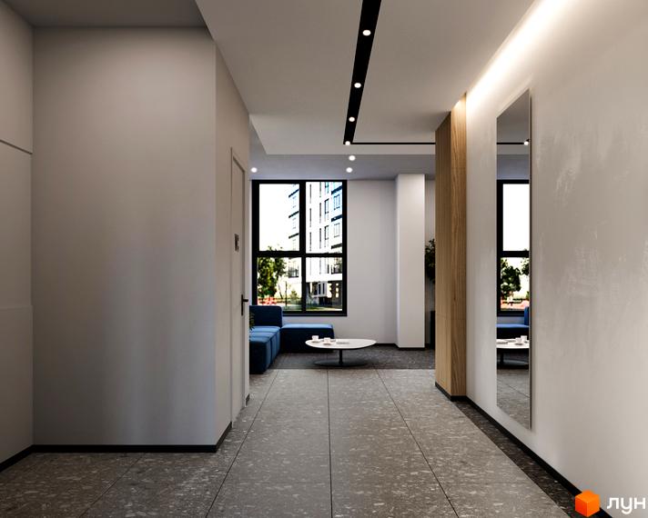 Дизайн холу в ЖК River City з синім диваном та кавовим столиком. Просторий коридор з великими вікнами та дзеркалом.