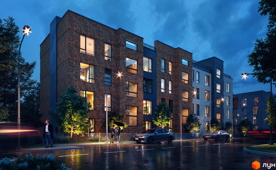 Житловий комплекс Art Misto Smart з цегляним фасадом та великими вікнами ввечері. Навколо будівлі освітлена територія з деревами та дорогою.
