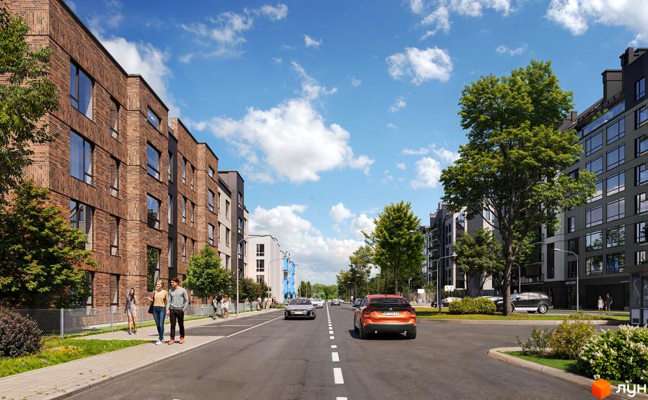 Житловий комплекс Art Misto Smart з цегляними будинками та зеленими насадженнями. Дорога з автомобілями та пішоходами, сонячна погода, блакитне небо.