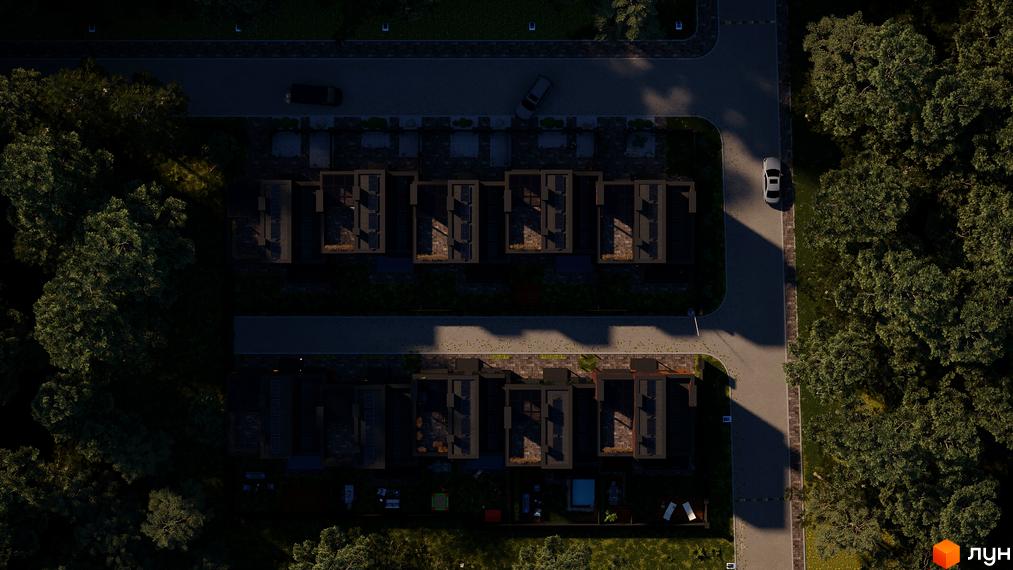 Вид зверху на таунхауси Madera House. Будинки з плоскими дахами, перед кожним будинком невелика ділянка з травою, поруч дерева та дорога.