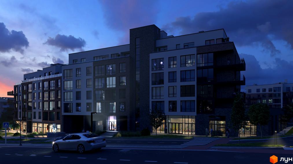 Зовнішній вигляд житлового комплексу Масив Преміум у вечірній час з освітленими вікнами та прибудинковою територією. Комплекс має багатоповерхові будівлі з цегляними та світлими фасадами.