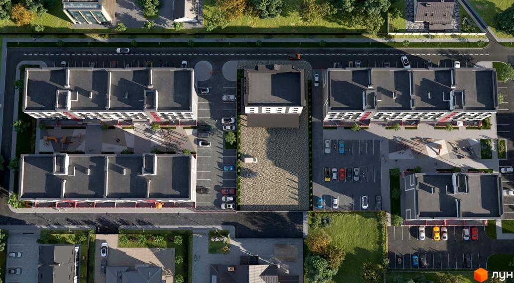 Вид зверху на житловий комплекс Рідний-3 з сучасними будинками та упорядкованою прибудинковою територією з парковкою та зеленими зонами.