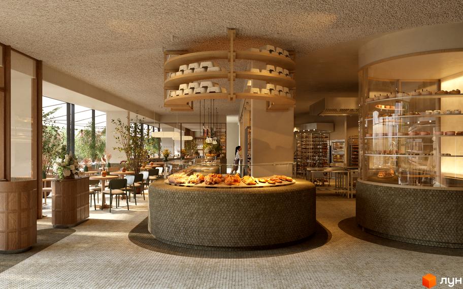 Інтер'єр пекарні в FOMICH TOWN з викладками випічки та сидіннями для гостей. Сучасний дизайн простору для відвідувачів.