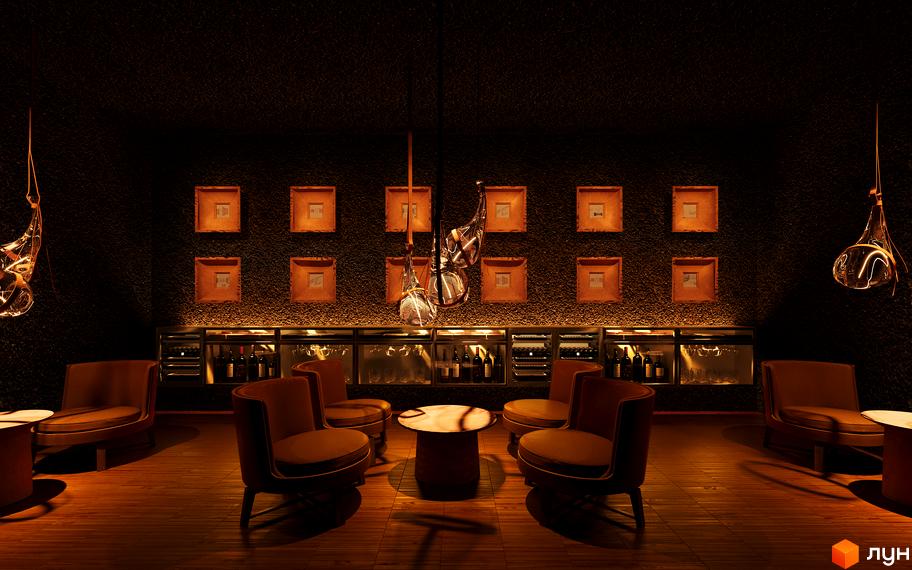 Інтер'єр лаунж-зони житлового комплексу КМ FOMICH TOWN з кавовим столиком та зручними кріслами. Дизайн інтер'єру новобудови.