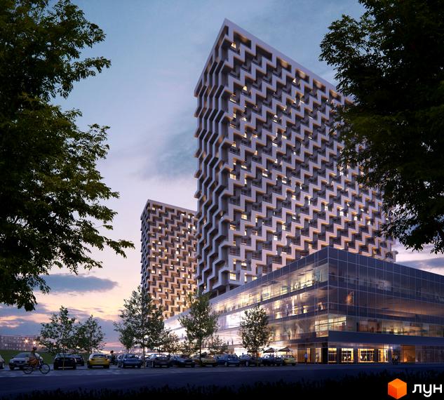 BOSTON Creative House: дві високі будівлі з візерунчастими фасадами та скляним комерційним поверхом, оточені деревами та парковкою.