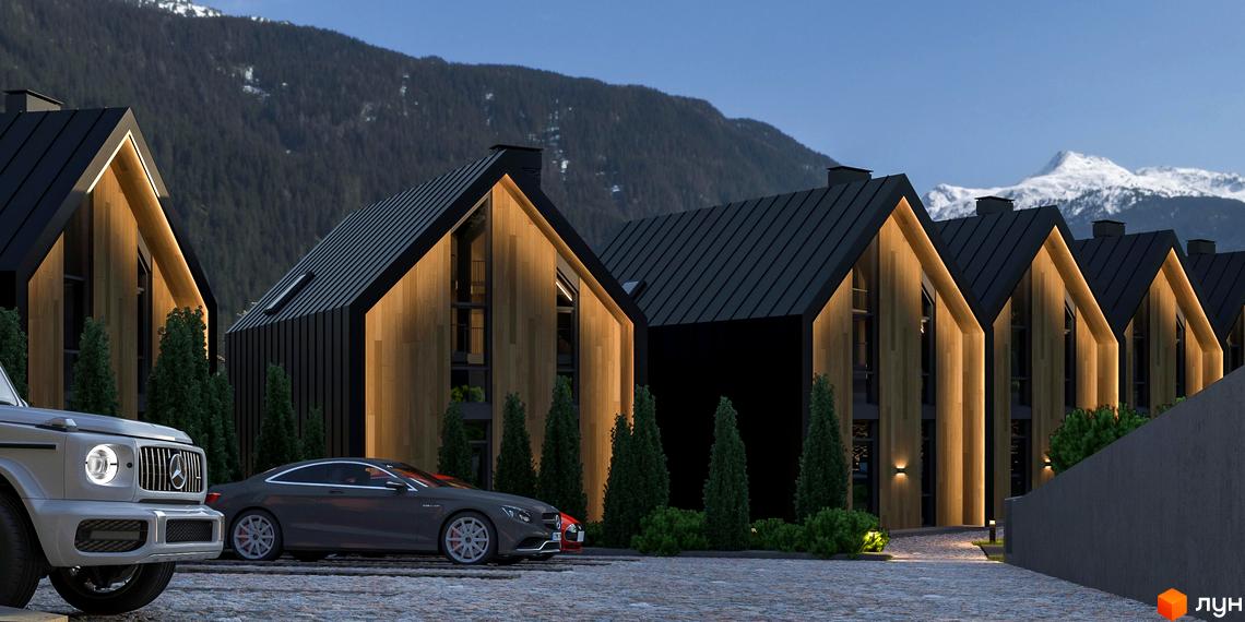 Котеджне містечко SKELYAR з дерев'яними фасадами та чорними дахами на тлі гір. На передньому плані припарковані автомобілі та зелені насадження.