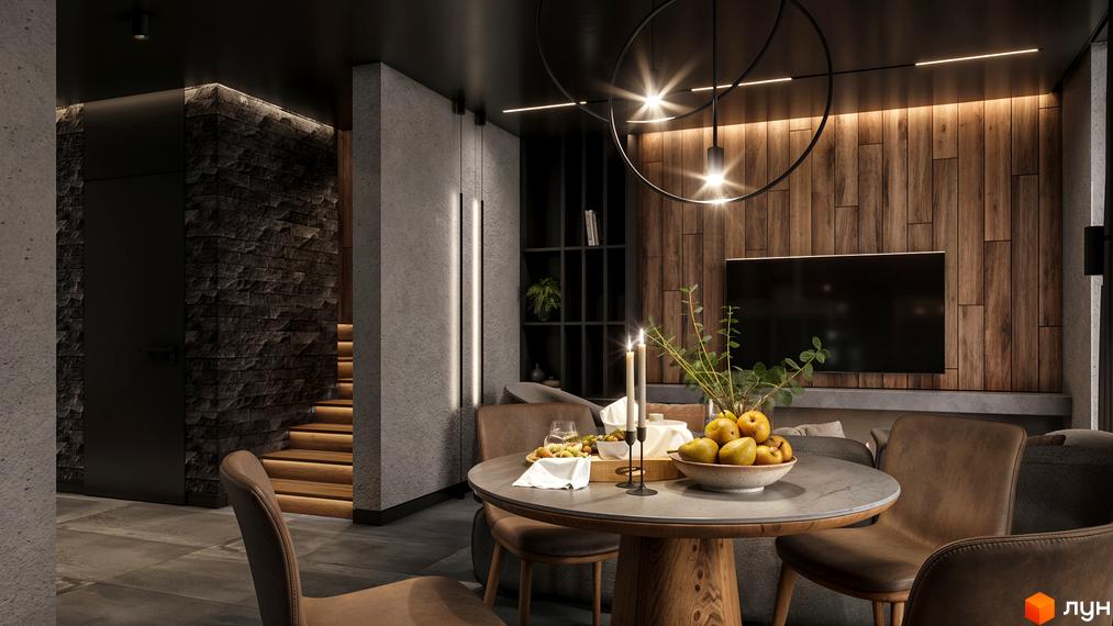 Інтер'єр вітальні з каміном та обідньою зоною в житловому комплексі КМ SKELYAR. Стильні меблі та оздоблення створюють затишну атмосферу.