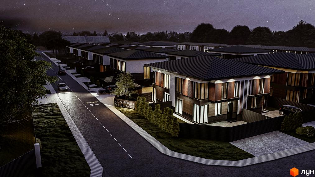 Котеджне містечко Garden Village Petropavlivka. Сучасні двоповерхові будинки з темними дахами та великими вікнами, розташовані вздовж дороги з освітленням.