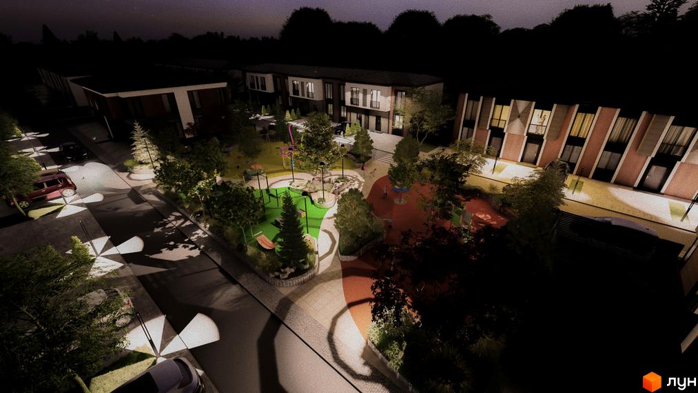 Котеджне містечко Garden Village Petropavlivka. Нічний вигляд будинків та освітленого дитячого майданчика з деревами.