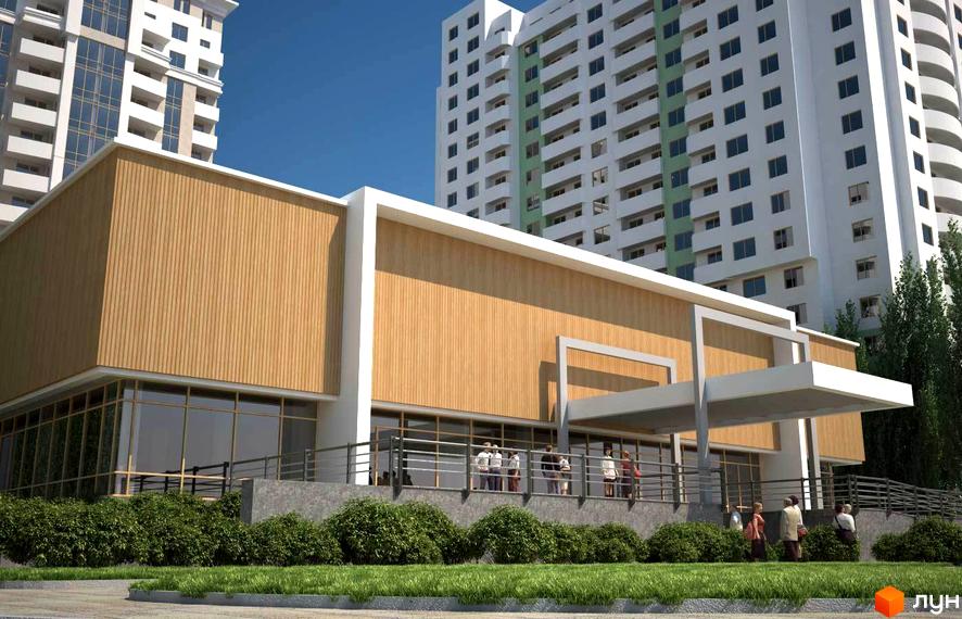 Житловий комплекс Європейський з сучасною архітектурою та прибудинковою територією, озелененою газонами та кущами.