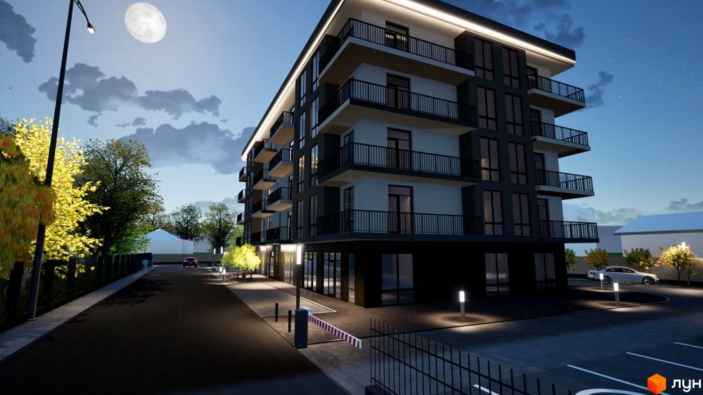 Зовнішній вигляд житлового комплексу Загорський вночі з балконами та вікнами. Прибудинкова територія з дорогою, ліхтарями та парканом.