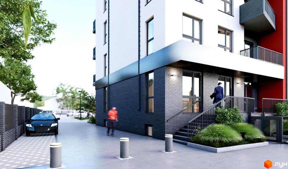 Житловий комплекс FreeDom: фасад будівлі з сірої цегли та білої штукатурки, з балконами та входом. Територія біля будинку з доріжками, кущами та автомобілем.
