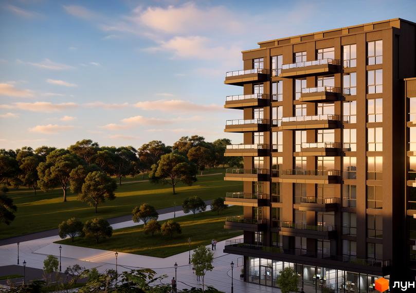 Житловий комплекс AUROOM URBAN з цегляним фасадом та балконами, оточений зеленим парком з деревами та пішохідними доріжками.