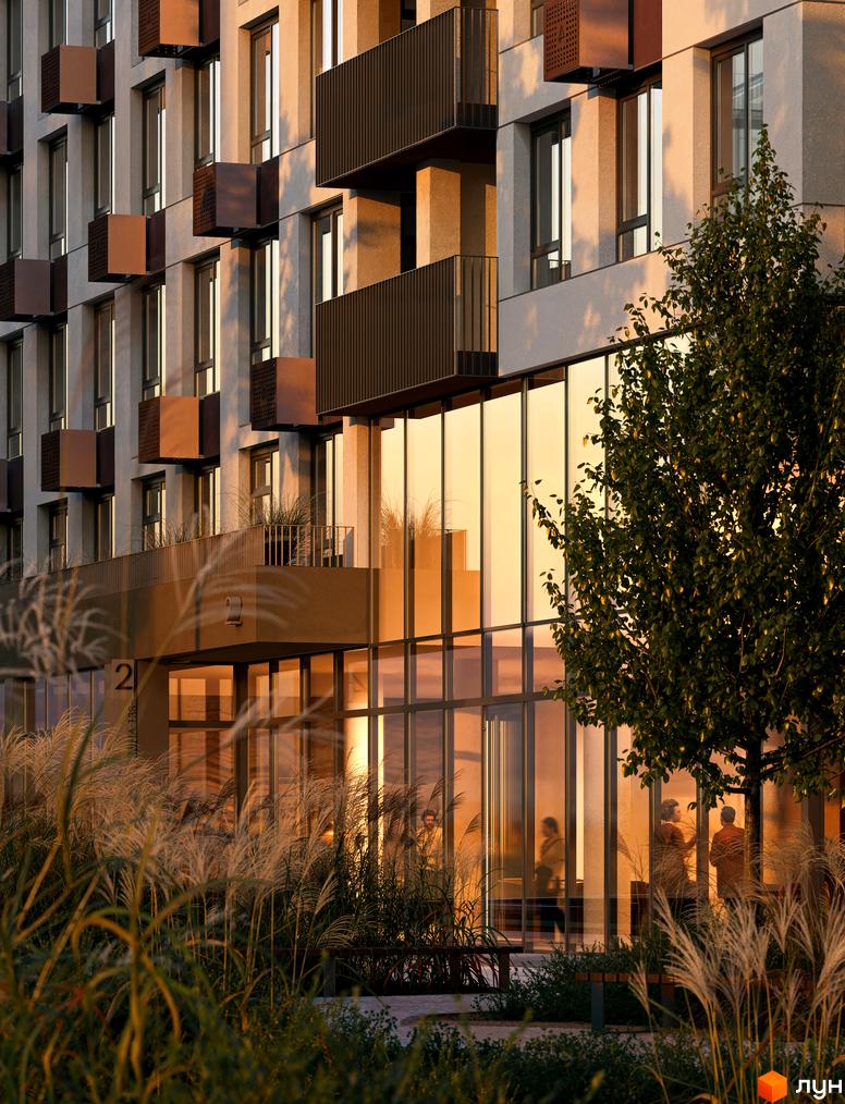 Житловий комплекс Avalon Terra з великими вікнами та балконами, оточений зеленню та травами. Зовнішній вигляд будинку та прибудинкова територія.