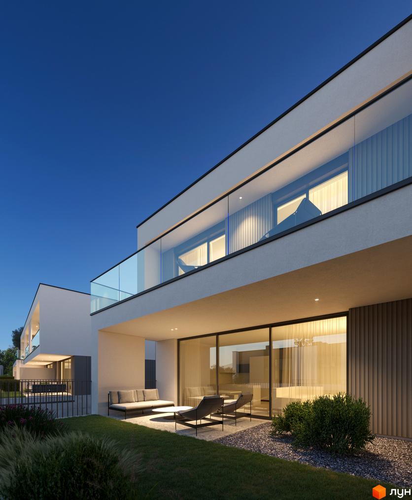 Котеджне містечко Bergman Park з білими фасадами, скляними балконами та терасою з диваном і кріслами. Навколо зелений газон та кам'яна доріжка.