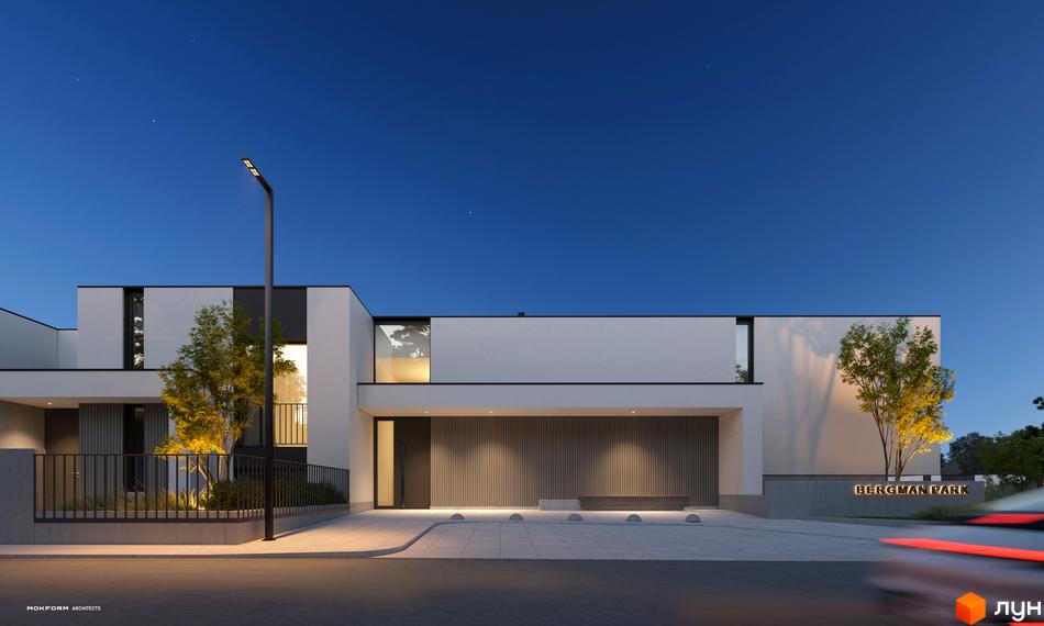 Котеджне містечко Bergman Park. Зовнішній вигляд будинку з підсвіченим фасадом та прибудинковою територією з деревами та освітленням.