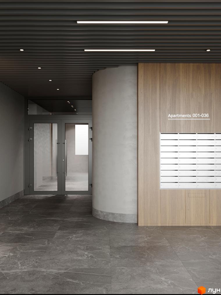 Сучасний вхід до ЖК AVANT PARK з сірими стінами, скляними дверима та поштовими скриньками на дерев'яній панелі.